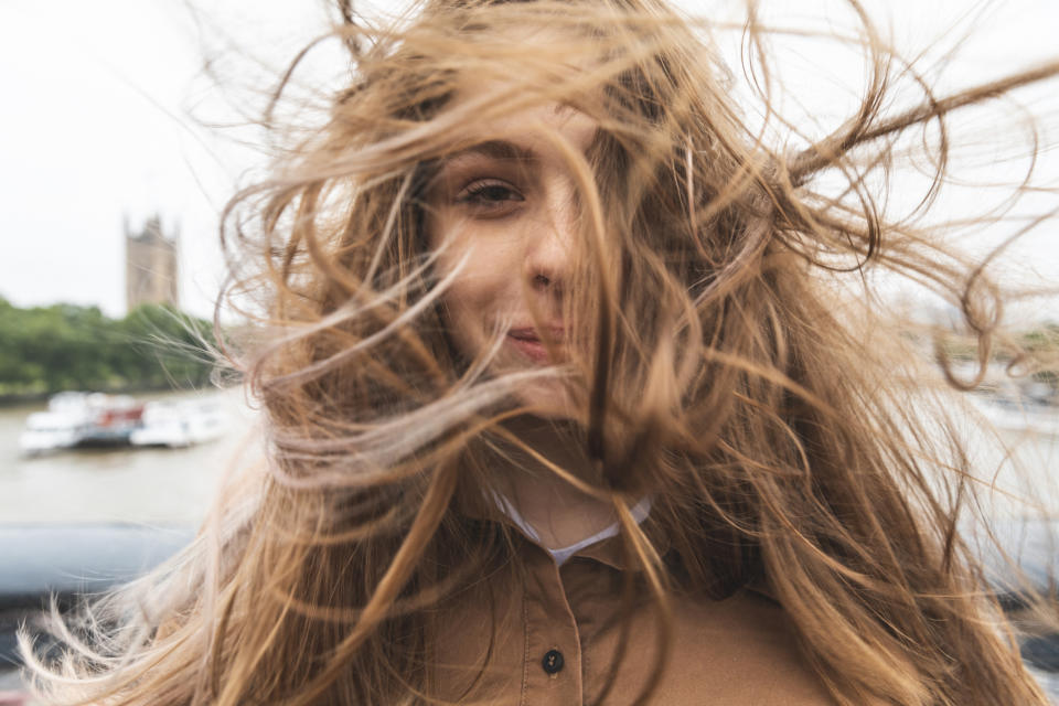 Woman in windy weather. (Getty Images)