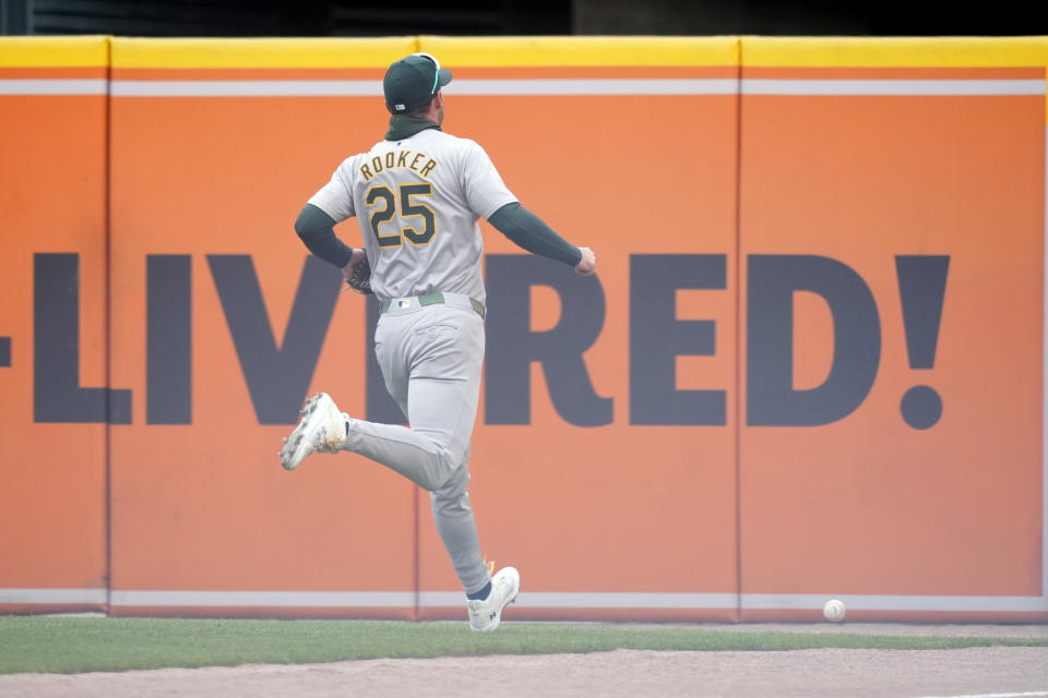 Oakland Athletics right fielder Brent Rooker chases the double by Detroit Tigers' Gio Urshela during the eighth inning of a baseball game, Friday, April 5, 2024, in Detroit. (AP Photo/Carlos Osorio)