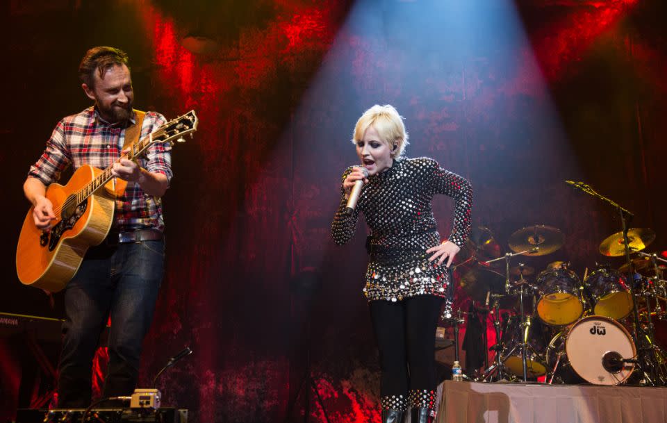 The Cranberries eventually reunited in 2009. The lead singer is seen on stage here with bandmate Noel Hogan. Source: Getty