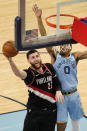 Portland Trail Blazers' Jusuf Nurkic (27) drives against Memphis Grizzlies' De'Anthony Melton (0) in the second half of an NBA basketball game Wednesday, April 28, 2021, in Memphis, Tenn. (AP Photo/Mark Humphrey)