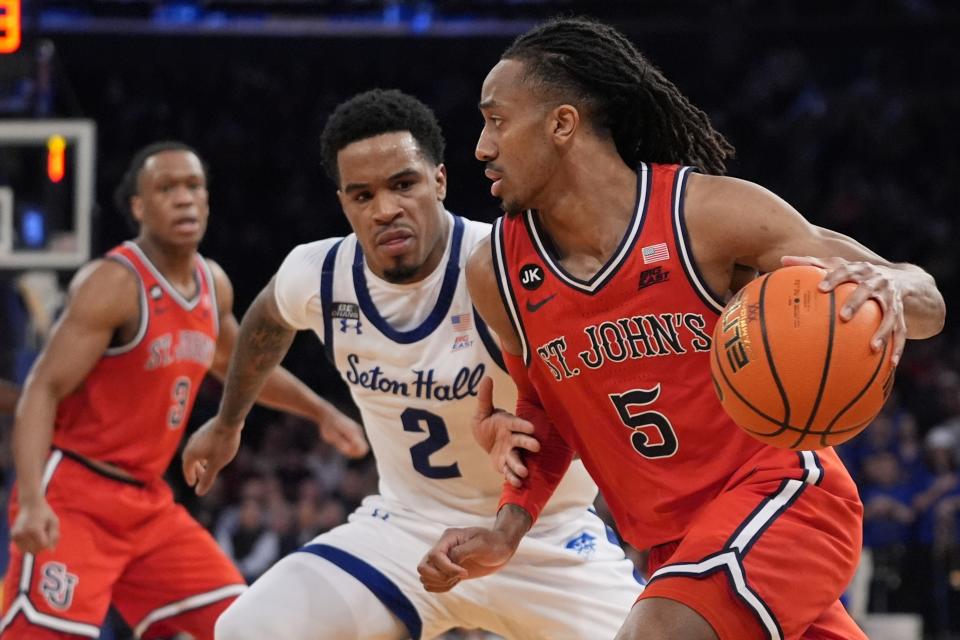 St. John's Daniss Jenkins (5) drives past Seton Hall's Al-Amir Dawes (2) during the second half of an NCAA college basketball game in the quarterfinal round of the Big East Conference tournament, Thursday, March 14, 2024, in New York. St. John's won 91-72. (AP Photo/Frank Franklin II)