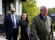 Huawei's Financial Chief Meng Wanzhou leaves her family home flanked by private security in Vancouver, British Columbia, Canada, May 8, 2019. REUTERS/Lindsey Wasson