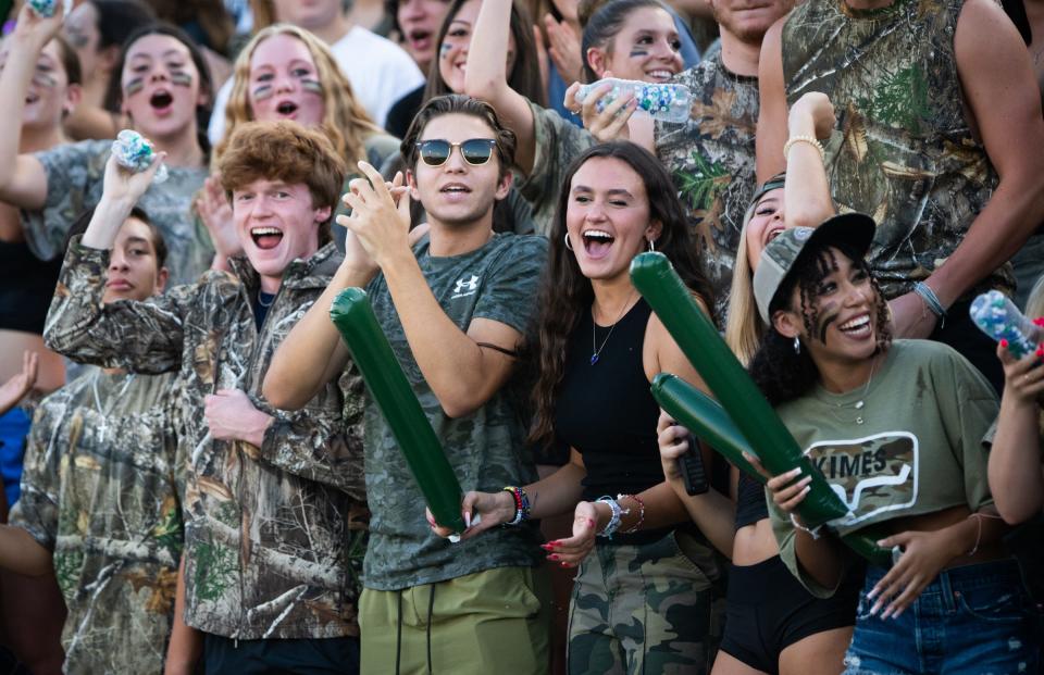 McNeil students celebrate a play during the first half of Thursday night's game against Hendrickson at the Kelly Reeves Athletic Complex, Hendrickson won 31-17.