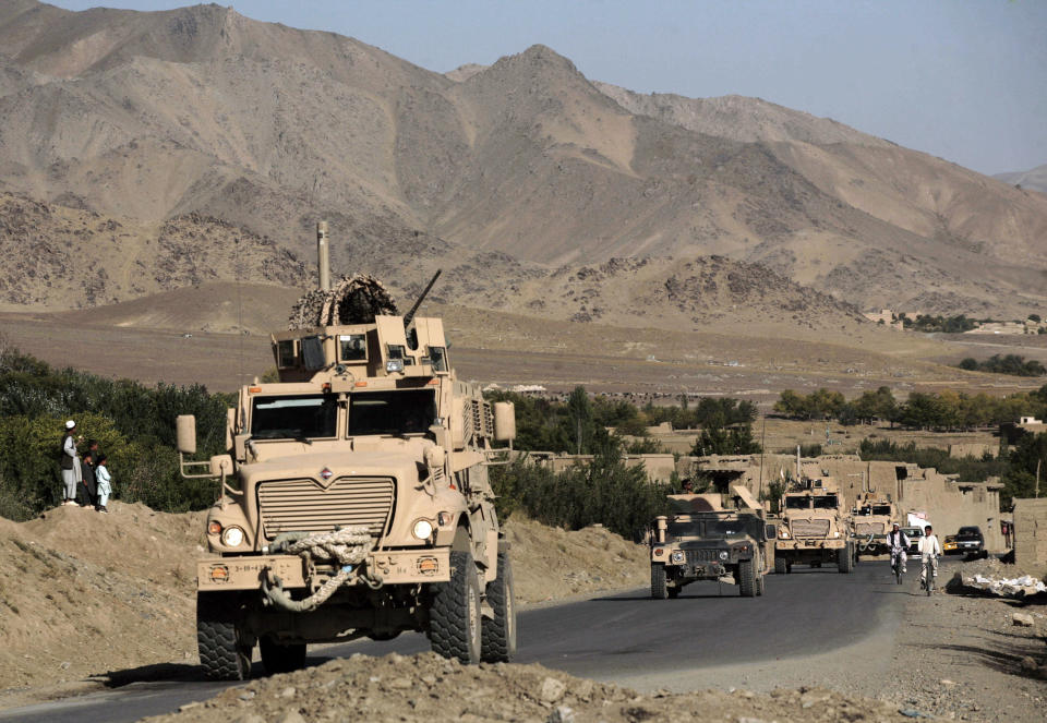 FILE- In this file photo taken Sept. 23, 2009, a column of U.S. Army mine-resistant armored vehicles (MRAPs) and Afghan National Army vehicles pass through a village during a joint patrol in the Jalrez Valley in Afghanistan's Wardak Province. As the United States military packs up to leave Afghanistan, ending 13 years of war, it is looking to sell or dispose of billions of dollars in military hardware, including its sophisticated and highly specialized mine resistant vehicles, but finding a buyer is complicated in a region where relations between neighboring countries are mired in suspicion and outright hostility.(AP Photo/Maya Alleruzzo, file)