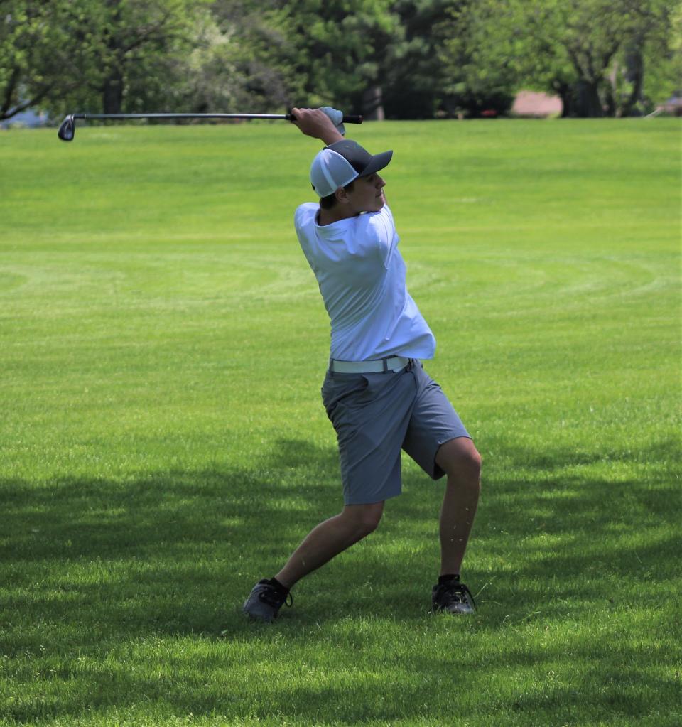 Matthew Zwack of St. Mary Catholic Central hits out of the rough during the Monroe County Championship Monday.