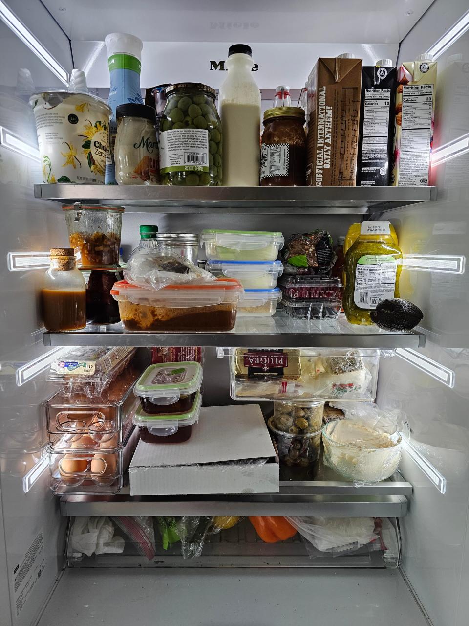 Inside Carla Hall's fridhe - leftovers, olives, oat milk, and eggs