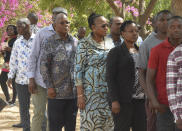 The ruling party CCM presidential candidate Dr. John Magufuli, third left, stands in line to cast his vote at Chamwino in Dodoma Wednesday. Oct. 28, 2020. The populist Magufuli, who made his name in part by targeting corruption, now seeks a second five-year term in one of Africa's most populous and fastest-growing economies. (AP Photo)