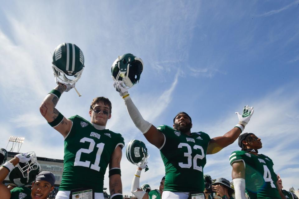 Sep 16, 2023; Athens, Ohio, USA; Ohio University Bobcats safety Austin Brawley (21) and linebacker Bryce Houston (32) celebrate after the game against the Iowa State Cyclones at Peden Stadium. Mandatory Credit: Matt Lunsford-USA TODAY Sports