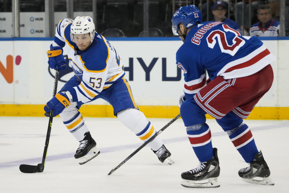 Buffalo Sabres left wing Jeff Skinner (53) looks to pass against New York Rangers center Barclay Goodrow (21) during the third period of an NHL hockey game, Monday, April 10, 2023, in New York. (AP Photo/John Minchillo)