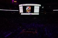 The video screen inside Staples center displays pictures of Kobe and Gianna Bryant as people arrive to attend the "Celebration of Life for Kobe and Gianna Bryant" service at Staples Center in Downtown Los Angeles on February 24, 2020. (Photo by Frederic J. BROWN / AFP) (Photo by FREDERIC J. BROWN/AFP via Getty Images)