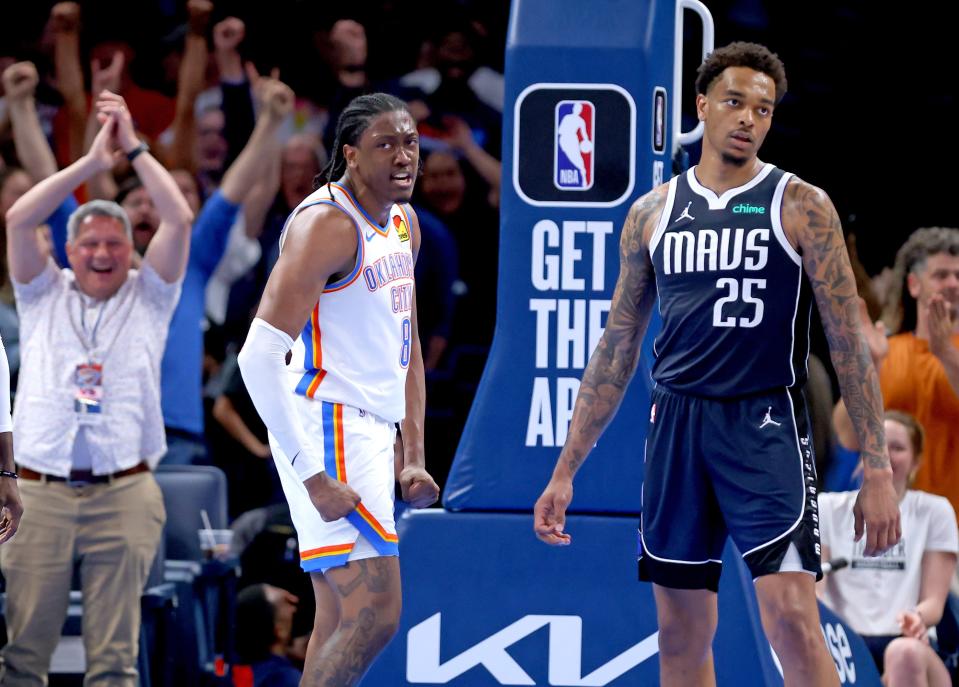 Oklahoma City Thunder's Jalen Williams (8) celebrates a dunk next to Dallas Mavericks' P.J. Washington (25) in the second half of the NBA basketball game between the Oklahoma City Thunder and Dallas Mavericks at Paycom Center in Oklahoma City, Thursday, March 14, 2024.