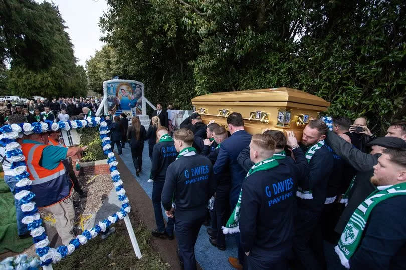 Jim's coffin is carried to his burial plot at Western Cemetery