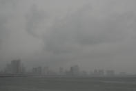 Rains start to pour as Typhoon Noru approaches Manila, Philippines, Sunday, Sept. 25, 2022. The powerful typhoon shifted and abruptly gained strength in an "explosive intensification" Sunday as it blew closer to the northeastern Philippines, prompting evacuations from high-risk villages and even the capital, which could be sideswiped by the storm, officials said. (AP Photo/Aaron Favila)