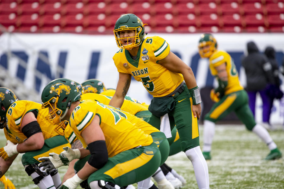 North Dakota State quarterback Trey Lance (5) yells instructions to his team during warmups before the FCS championship NCAA college football game against James Madison, Saturday, Jan. 11, 2020, in Frisco, Texas. (AP Photo/Sam Hodde)