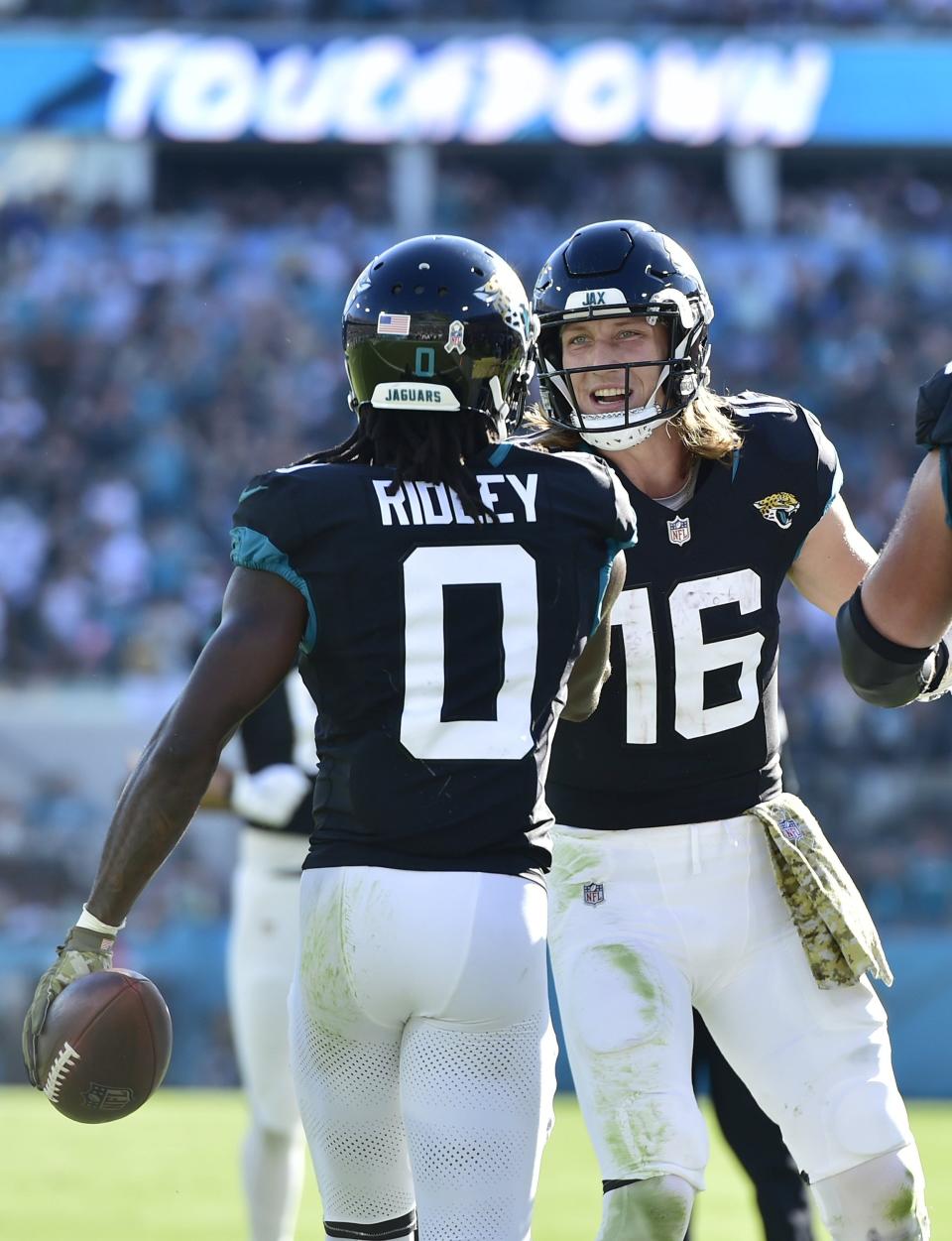 Jacksonville Jaguars quarterback Trevor Lawrence (16) greets teammate wide receiver Calvin Ridley (0) after he pulled in a Lawrence pass for a touchdown late in the third quarter. The Jacksonville Jaguars hosted the Tennessee Titans at EverBank Stadium in Jacksonville, FL Sunday, November 19, 2023. The Jaguars led 13 to 0 at the half and walked away with a 34 to 14 win over the Titans. [Bob Self/Florida Times-Union]