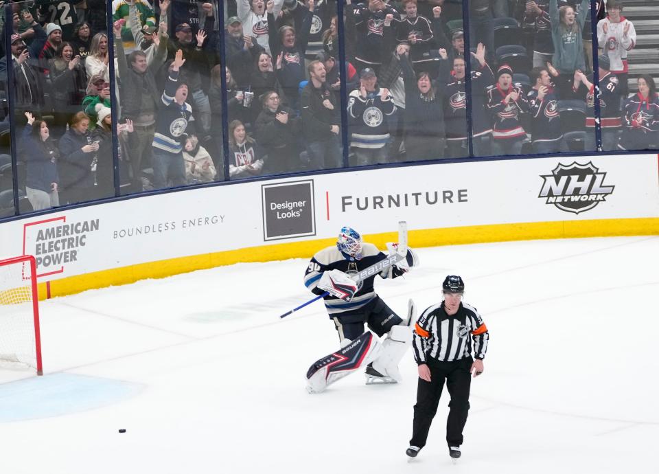 Columbus Blue Jackets goaltender Elvis Merzlikins (90) celebrates following the shootout in the NHL hockey game against the Minnesota Wild at Nationwide Arena in Columbus on March 11, 2022. The Blue Jackets won 3-2 in a shootout.