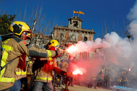 Firemen take part in a protest in front of Catalunya's Parliament in Barcelona, Spain, December 20, 2018. REUTERS/Juan Medina