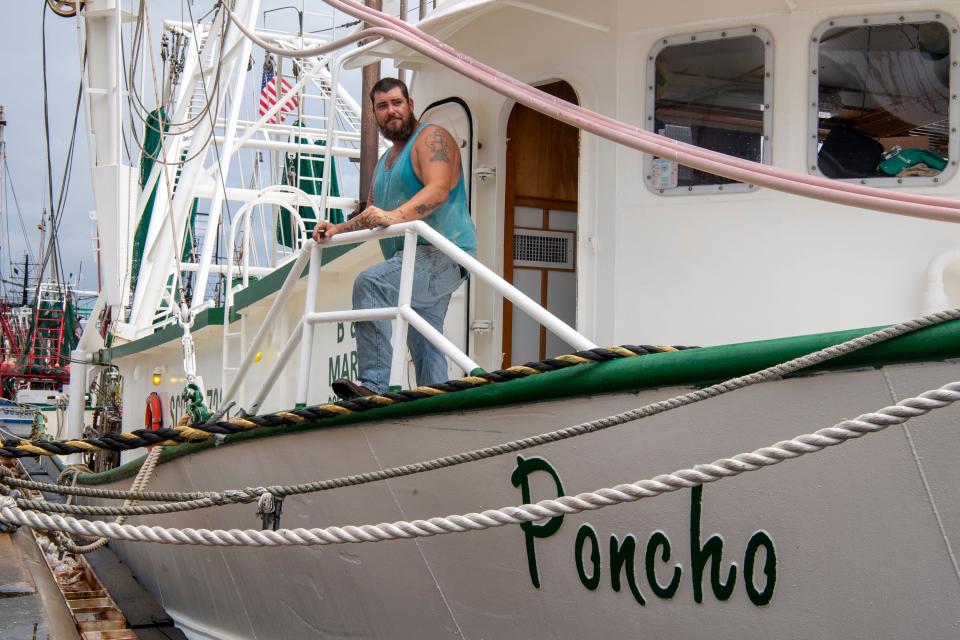 Captain John Minton stands aboard the Poncho in the Port of Lake Charles after being hammered by Hurricane Laura with he and his crew aboard riding out the storm.