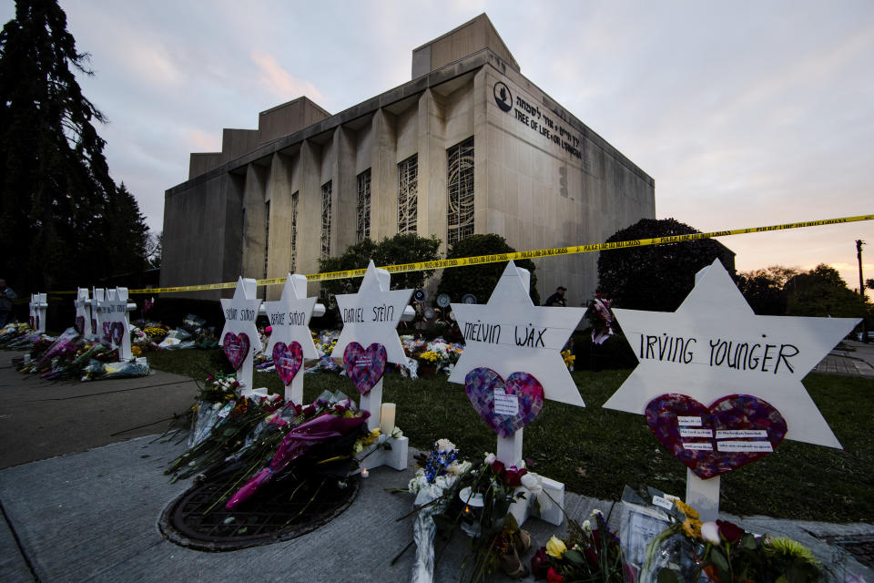 FILE - In this Oct. 29, 2018 file photo, a makeshift memorial stands outside the Tree of Life Synagogue in the aftermath of a deadly shooting at the in Pittsburgh. Organizers have strived to offer emotional support during the second anniversary commemorations. One-on-one counseling will be offered virtually, and there's a tent set up near the synagogue where people can access in-person support from humans and comfort dogs. (AP Photo/Matt Rourke, File)