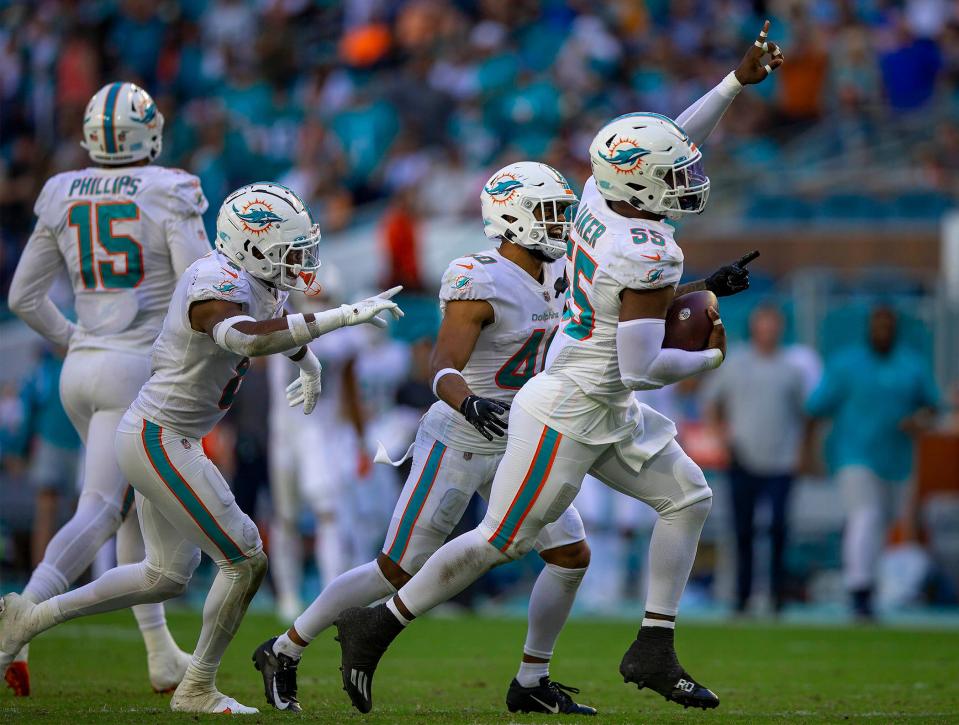 Dolphins linebacker Jerome Baker, celebrating after an interception against the Texans last month, is now lining up more on the edge than in the middle of the field.