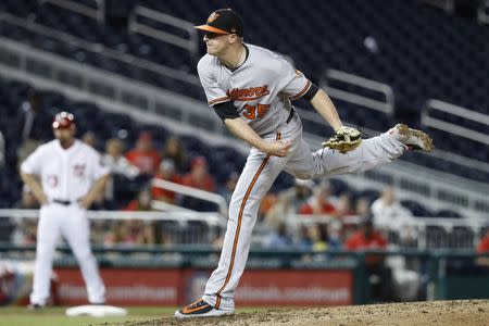 Jun 20, 2018; Washington, DC, USA; Baltimore Orioles relief pitcher Brad Brach (35) pitches against the Washington Nationals in the ninth inning at Nationals Park. Mandatory Credit: Geoff Burke-USA TODAY Sports