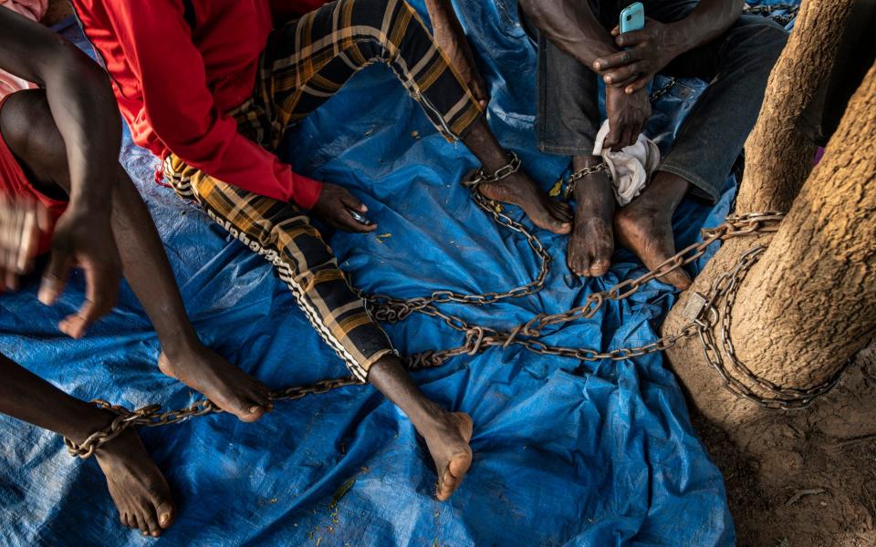 Prisoners of the self defence force the Koglweogo in the village of Poessin near Ouagadougou - Simon Townsley