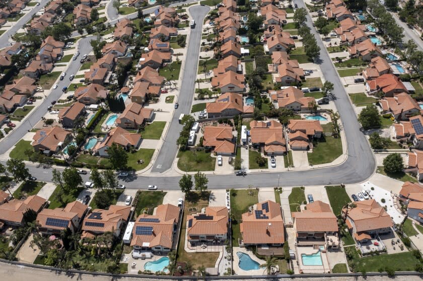 Rancho Cucamonga, CA, Wednesday, April 27, 2022 - A drone image over a housing tract that is part of the state water project, where outdoor watering to one day a week. Water Shortage Emergency to be declared in communities in Los Angeles, San Bernardino and Ventura counties, home to 6 million Southern Californians. These homes are located near the intersection of Wilson and Milliken Avenues. (Robert Gauthier/Los Angeles Times)