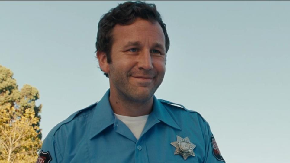 Chris O'Dowd smiling in Bridesmaids,