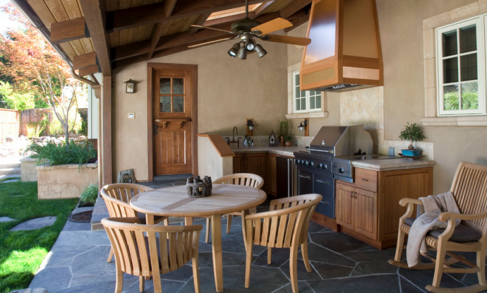 <p>Centered around the built-in grill, this partially enclosed patio kitchen hasthe added comfort of a cooling fan. Credit: <a href="http://www.conrado.com/" rel="nofollow noopener" target="_blank" data-ylk="slk:Conrado Home Builders;elm:context_link;itc:0" class="link ">Conrado Home Builders</a><br><br></p>