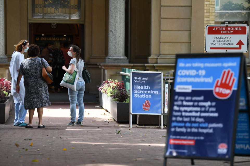 Staff wearing face masks outside the Royal Prince Alfred Hospital in Camperdown. Source: AAP