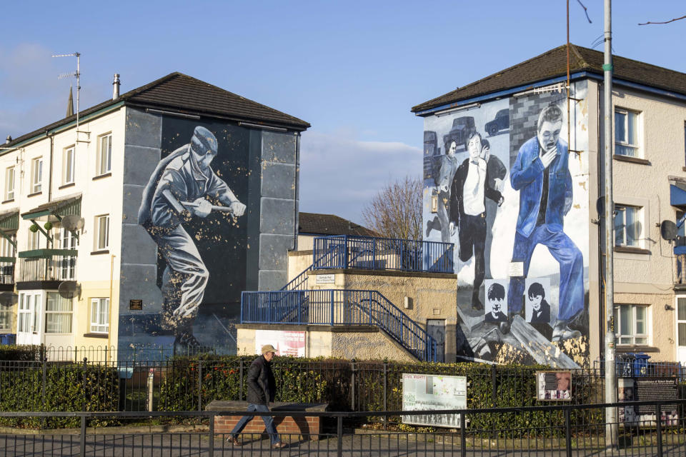 Operation Motorman, left, and The Runner murals by the Bogside Artists in Derry’s Bogside (Liam McBurney/PA)