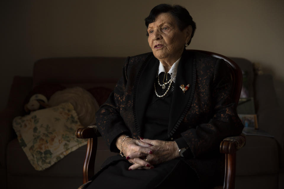 In this Wednesday, Jan. 23, 2019 photo, Holocaust survivor Cipora Feivlovich speaks to The Associated Press at her house in Jerusalem. As the world commemorates the anniversary of the liberation of Auschwitz on International Holocaust Remembrance Day, death camp survivor Feivlovich marks her own personal milestone as she turns 92. She’s spent her most recent birthdays recounting to audiences in Israel and Germany her harrowing experiences in the infamous camp, where her parents, brother and best friends all perished. (AP Photo/Sebastian Scheiner)