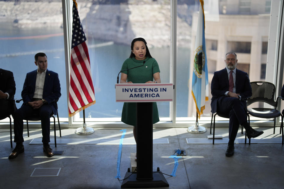 Camille Calimlim Touton, Commissioner at the Bureau of Reclamation, speaks during a news conference on Lake Mead at Hoover Dam, Tuesday, April 11, 2023, near Boulder City, Nev. The Biden administration on Tuesday released an environmental analysis of competing plans for how Western states and tribes reliant on the dwindling Colorado River should cut their use. (AP Photo/John Locher)