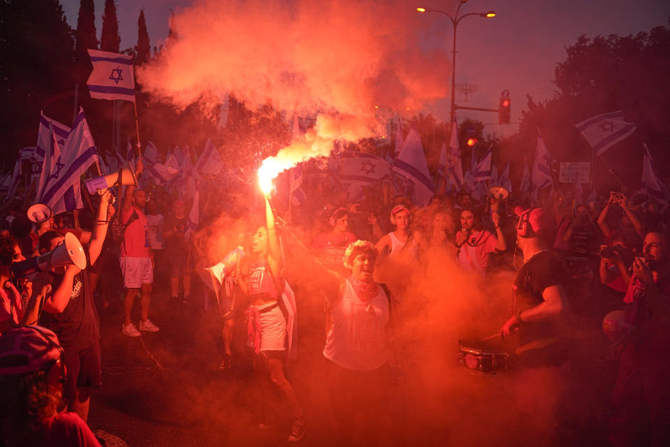 Israelis protest against plans by Prime Minister Benjamin Netanyahu's government to overhaul the judicial system in Tel Aviv, Israel, Saturday, July 15, 2023. (AP Photo/Ariel Schalit)