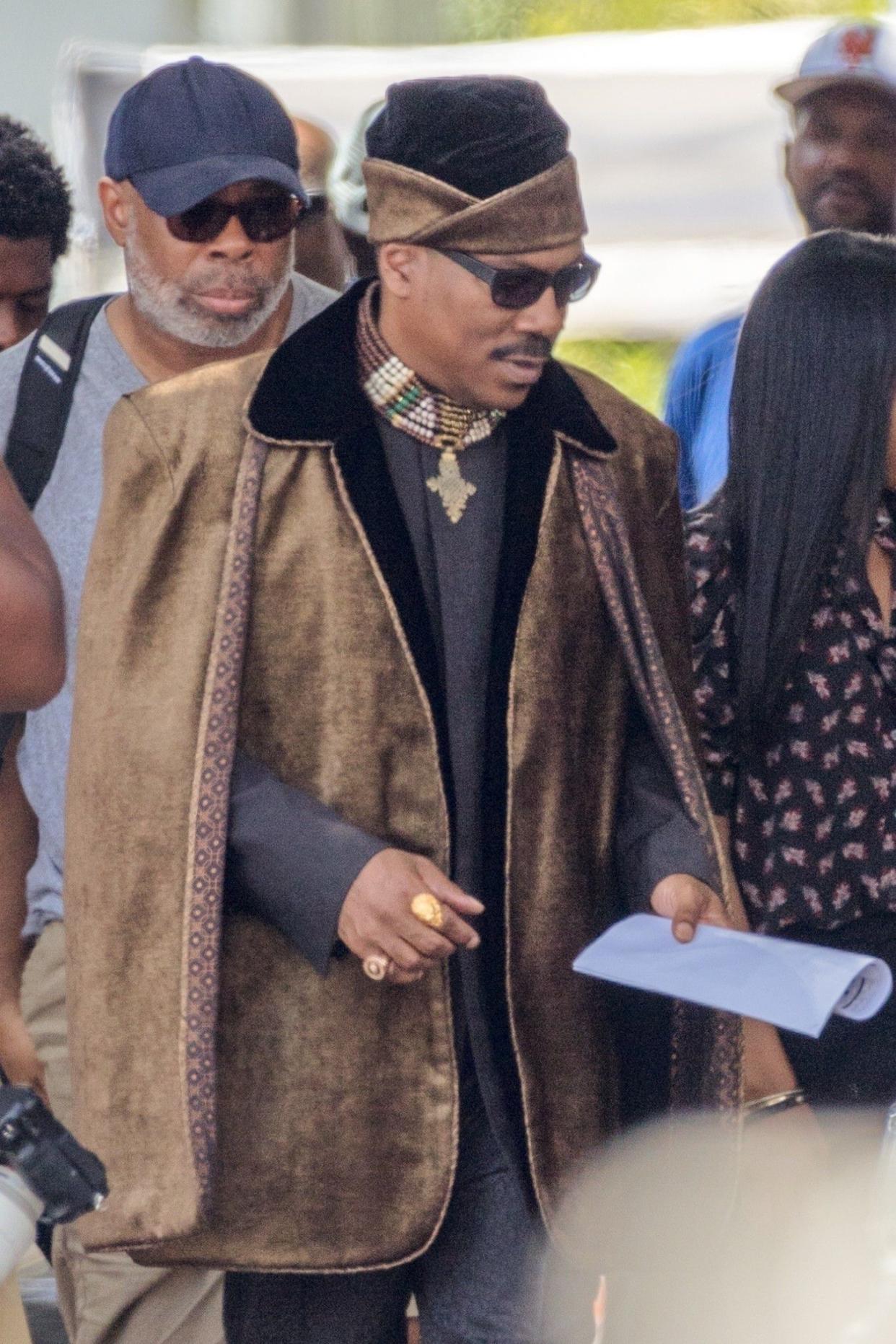 Murphy was also seen in character on set on Friday, dressed as Prince Akeem in head-to-toe royal regalia. “Coming 2 America” will follow Akeem and Semmi, Hall’s main character, returning to Queens, New York looking for Akeem’s son.
