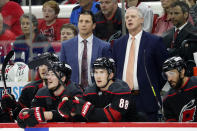 Carolina Hurricanes coach Rod Brind'Amour, left, and assistant coach Jeff Daniels watch from the bench during the second period of Game 5 of the team's NHL hockey Stanley Cup second-round playoff series against the New York Rangers in Raleigh, N.C., Thursday, May 26, 2022. (AP Photo/Karl B DeBlaker)