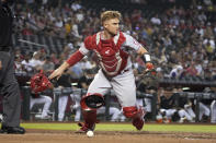 Los Angeles Angels catcher Max Stassi throws his gear after blocking the ball in the third inning during a baseball game against the Arizona Diamondbacks, Saturday, June 12, 2021, in Phoenix. (AP Photo/Rick Scuteri)