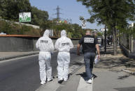 <p>Policce officers arrive at a bus stop in La Valentine district after a van rammed into two bus stops in the French port city of Marseille, southern France, Aug. 21, 2017. (Photo: Claude Paris/AP) </p>