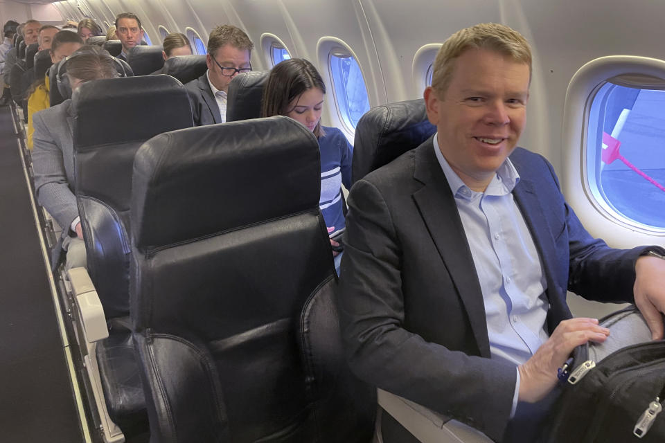 New Zealand's Prime Minister Chris Hipkins, right, sits on a plane traveling from Wellington to New Plymouth on Monday, Sept. 25, 2023. With less than three weeks to go until a general election, opinion polls have put Hipkins and his Labour Party significantly behind the National Party, led by former businessman Christopher Luxon. (AP Photo/Nick Perry)