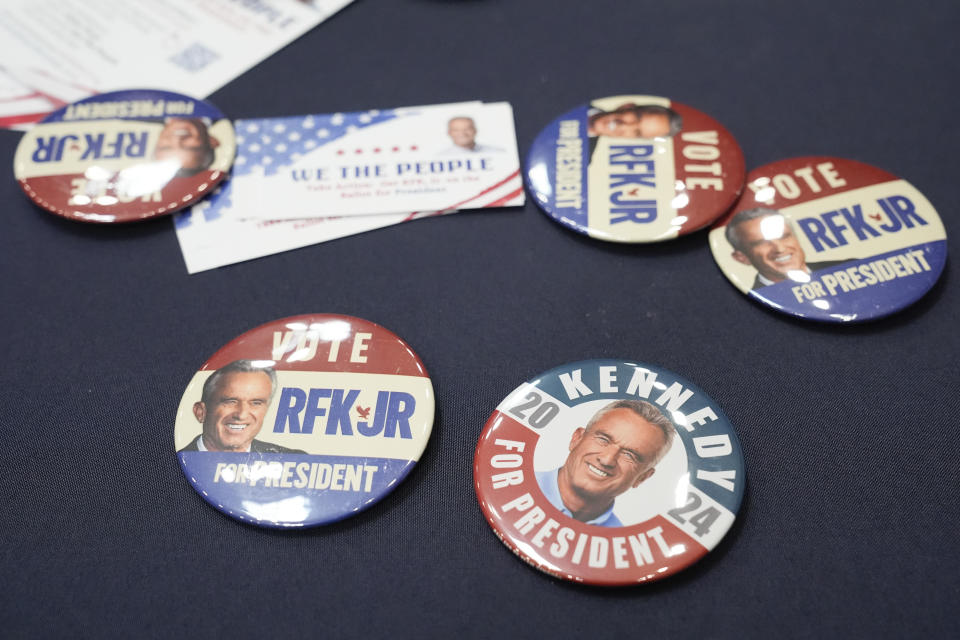 Buttons are displayed during a campaign event for Presidential candidate Robert F. Kennedy Jr., Tuesday, March 26, 2024, in Oakland, Calif. (AP Photo/Eric Risberg)