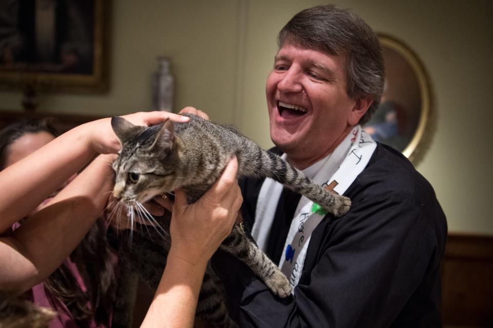 Margot wiggles free as she is blessed by Rev. W.R. ÒRustyÓ McCown during the 22nd annual blessing of the animals at St. Paul's Episcopal Church in Franklin, Tenn., Sunday, Oct. 8, 2017.