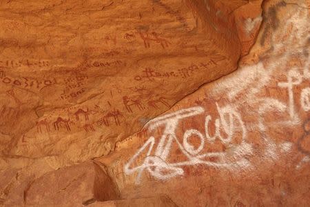 Vandalised rock art is pictured at Tadrart Acacus, in Ghat May 30, 2014. REUTERS/Aimen Elsahli