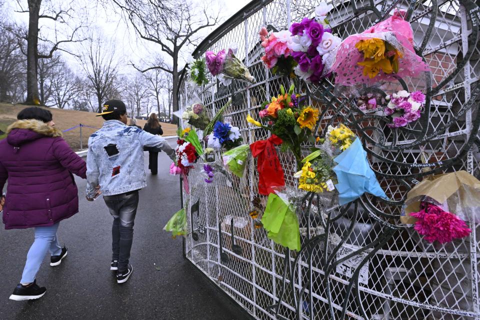 Fans enter Graceland for a memorial service for Lisa Marie Presley Sunday, Jan. 22, 2023, in Memphis, Tenn. She died Jan. 12 after being hospitalized for a medical emergency and was buried on the property next to her son Benjamin Keough, and near her father Elvis Presley and his two parents. (AP Photo/John Amis)