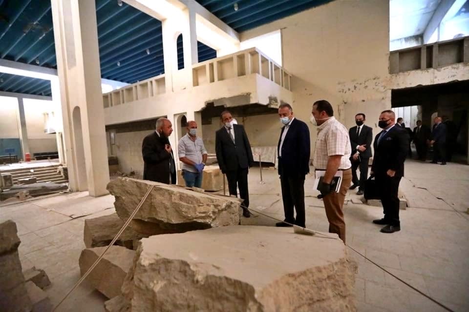 TAKES OUT REFERENCE TO DESIGNATE - Iraqi Prime Minister Mustafa al-Kahdimi, center right, inspects artifacts destroyed by Islamic State militants at the national museum during his visit to Mosul, Iraq, Wednesday, June 10, 2020. (Iraqi Prime Minister Media Office, via AP)