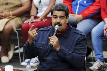 Venezuela's President Nicolas Maduro speaks during a rally against the opposition's law granting titles of property to beneficiaries of Mission Housing, a low-income social housing project, in Caracas April 14, 2016. REUTERS/Marco Bello