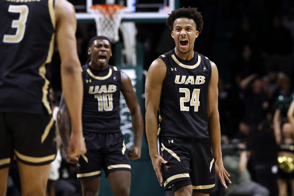 UAB guard Efrem Johnson (24) reacts after making a 3-pointer against Florida Atlantic during overtime in an NCAA college basketball game Thursday, Feb. 8, 2024, in Birmingham, Ala. (AP Photo/ Butch Dill)