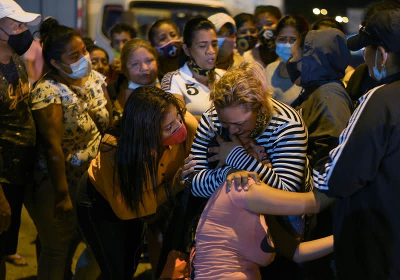 A woman reacts outside a prison where inmates were killed during a riot that the government described as a concerted action by criminal organisations, in Guayaquil