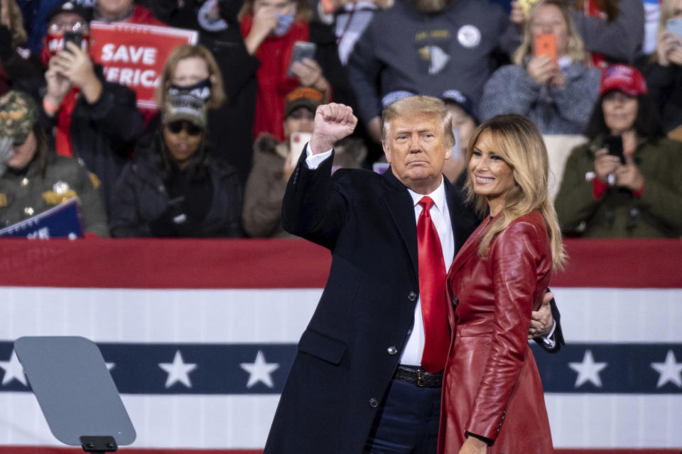 President Donald Trump and first lady Melania Trump prepare to leave a rally for U.S. Senators Kelly Loeffler, R-Ga., and David Perdue, R-Ga., who are both facing runoff elections Saturday, Dec. 5, 2020, in Valdosta, Ga. (AP Photo/Ben Gray)