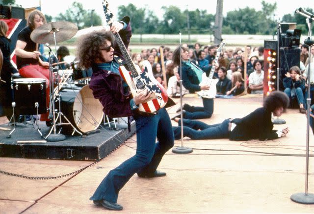 <p>Leni Sinclair/Michael Ochs Archive/Getty</p> Wayne Kramer performing with MC5