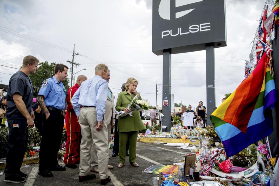 Hillary Clinton visits a memorial outside of the Pulse nightclub.